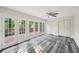 Bonus room with multiple glass paneled doors leading to deck and wooded view at 6841 Fairway Ridge Dr, Douglasville, GA 30134