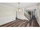 Dining area with chair railing and access to another room via staircase at 6841 Fairway Ridge Dr, Douglasville, GA 30134