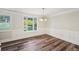Inviting dining room featuring a bay window, wainscoting and chandelier at 6841 Fairway Ridge Dr, Douglasville, GA 30134