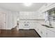 Spacious kitchen featuring ample counter space, a window view, and hardwood floors at 6841 Fairway Ridge Dr, Douglasville, GA 30134