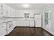 The recently renovated kitchen features white cabinets and modern appliances at 6841 Fairway Ridge Dr, Douglasville, GA 30134