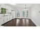 Bright kitchen with white cabinets, new countertops, updated hardware, and new appliances at 6841 Fairway Ridge Dr, Douglasville, GA 30134