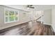 Bright living room boasting with natural light, features lovely flooring and staircase at 6841 Fairway Ridge Dr, Douglasville, GA 30134