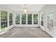 Sunroom with large windows offering plentiful natural light and lush outdoor views at 6841 Fairway Ridge Dr, Douglasville, GA 30134