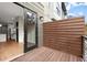 Deck area with wooden privacy screen has sliding doors leading to the home's interior at 2329 Mason Dr # D24, Atlanta, GA 30316