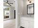 Bathroom featuring a modern white vanity with a black framed mirror and tile shower at 2329 Mason Dr # D24, Atlanta, GA 30316