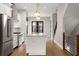 Modern kitchen featuring stainless steel appliances, white cabinetry and a center island with sink and faucet at 2329 Mason Dr # D24, Atlanta, GA 30316