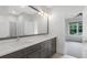 Modern bathroom with double sink vanity and quartz countertops at 2602 Drew Valley Ne Rd, Brookhaven, GA 30319