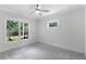 Bright bedroom with large windows providing natural light and views of the lush greenery outside at 2602 Drew Valley Ne Rd, Brookhaven, GA 30319
