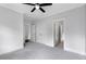 Grey Bedroom with white trim, large closets, and carpet at 2602 Drew Valley Ne Rd, Brookhaven, GA 30319