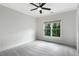 Bright bedroom with plush carpeting and a large window at 2602 Drew Valley Ne Rd, Brookhaven, GA 30319