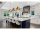 Gourmet kitchen with an expansive island, pendant lighting, stainless steel appliances, and ample counter space at 2602 Drew Valley Ne Rd, Brookhaven, GA 30319