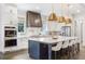 Bright kitchen featuring a large island with seating, stainless steel appliances, and modern finishes at 2602 Drew Valley Ne Rd, Brookhaven, GA 30319