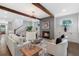 Inviting living room featuring a fireplace, hardwood floors, modern lighting, and comfortable seating at 2602 Drew Valley Ne Rd, Brookhaven, GA 30319