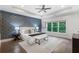 Spacious main bedroom features a tray ceiling, statement wall, and large windows at 2602 Drew Valley Ne Rd, Brookhaven, GA 30319
