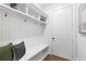 Mudroom features a built-in bench, hooks, shelving, and access to outside at 2602 Drew Valley Ne Rd, Brookhaven, GA 30319