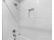 Clean white tiled shower with rainfall shower head at 2602 Drew Valley Ne Rd, Brookhaven, GA 30319