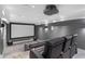 Movie theater room featuring comfortable seating, wall lighting, and a large screen at 2602 Drew Valley Ne Rd, Brookhaven, GA 30319
