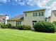 Spacious backyard with lush landscaping, mature trees, and a well-maintained lawn at 9602 Coastal Pointe Dr, Villa Rica, GA 30180