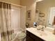 Clean bathroom featuring a shower and tub combo with a shower curtain, along with a single sink vanity at 9602 Coastal Pointe Dr, Villa Rica, GA 30180