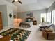 Bright bedroom boasts neutral walls, ceiling fan, and lots of natural light from the window at 9602 Coastal Pointe Dr, Villa Rica, GA 30180