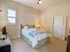 Comfortable bedroom with a ceiling fan, plush carpet, neutral paint, and a window with wooden shutters at 9602 Coastal Pointe Dr, Villa Rica, GA 30180