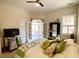 Comfortable bedroom featuring a ceiling fan, plush carpet, neutral walls, and French doors that lead to an outdoor area at 9602 Coastal Pointe Dr, Villa Rica, GA 30180