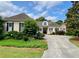 Inviting home exterior featuring a well-manicured lawn, mature trees, and a classic design with a welcoming entrance at 9602 Coastal Pointe Dr, Villa Rica, GA 30180
