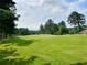 Expansive golf course view with lush green fairways and mature trees, near the house at 9602 Coastal Pointe Dr, Villa Rica, GA 30180