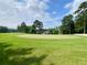 Expansive golf course view with lush green fairways and mature trees, near the house at 9602 Coastal Pointe Dr, Villa Rica, GA 30180