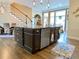 Spacious kitchen island with granite countertop, stainless steel dishwasher, and ample cabinet space at 9602 Coastal Pointe Dr, Villa Rica, GA 30180