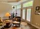 Sitting area with large windows, shutters, and French doors at 9602 Coastal Pointe Dr, Villa Rica, GA 30180