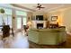 Cozy living room with fireplace, French doors, and elegant tray ceiling at 9602 Coastal Pointe Dr, Villa Rica, GA 30180