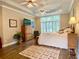 View of a large main bedroom featuring hardwood floors and ceiling fan at 9602 Coastal Pointe Dr, Villa Rica, GA 30180