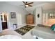 Spacious main bedroom features vaulted ceilings, plush carpet, and ensuite bathroom at 9602 Coastal Pointe Dr, Villa Rica, GA 30180