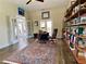 Bright office space with hardwood floors, eclectic furniture, and access to an outdoor patio at 9602 Coastal Pointe Dr, Villa Rica, GA 30180