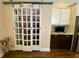 Large pantry features sliding barn doors and built-in shelving and storage at 9602 Coastal Pointe Dr, Villa Rica, GA 30180