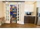 Large pantry features sliding barn doors and built-in shelving and storage at 9602 Coastal Pointe Dr, Villa Rica, GA 30180