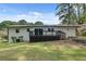 Back exterior featuring a lovely yard and a deck perfect for entertaining on sunny days at 1891 Sahara Se Dr, Atlanta, GA 30316