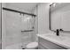 Bathroom with modern vanity, shower, and updated fixtures and glass shower door at 1891 Sahara Se Dr, Atlanta, GA 30316