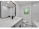 Bathroom featuring double vanity, mirror and modern tiling at 1891 Sahara Se Dr, Atlanta, GA 30316