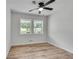Bedroom with hardwood flooring featuring double windows and a ceiling fan at 1891 Sahara Se Dr, Atlanta, GA 30316