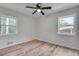 Well-lit bedroom featuring new flooring, neutral walls, and a modern ceiling fan at 1891 Sahara Se Dr, Atlanta, GA 30316