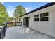 Large deck perfect for outdoor dining and entertaining with white brick exterior at 1891 Sahara Se Dr, Atlanta, GA 30316
