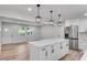 View of the open kitchen featuring a center island with a quartz countertop and stainless steel appliances at 1891 Sahara Se Dr, Atlanta, GA 30316