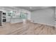 Bright, open-concept living room and kitchen with hardwood floors and stainless steel appliances at 1891 Sahara Se Dr, Atlanta, GA 30316