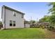 Expansive backyard with lush green lawn, manicured landscaping, and patio, ideal for outdoor entertaining and relaxing at 2023 Yellow Finch Trl, Atlanta, GA 30316