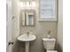 Charming powder room with a pedestal sink and stylish finishes at 2023 Yellow Finch Trl, Atlanta, GA 30316