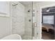 Bathroom featuring walk in shower with elegant tile and river rock shower floor at 2023 Yellow Finch Trl, Atlanta, GA 30316