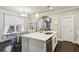 Kitchen with a large island, stainless steel dishwasher, and breakfast table at 2023 Yellow Finch Trl, Atlanta, GA 30316